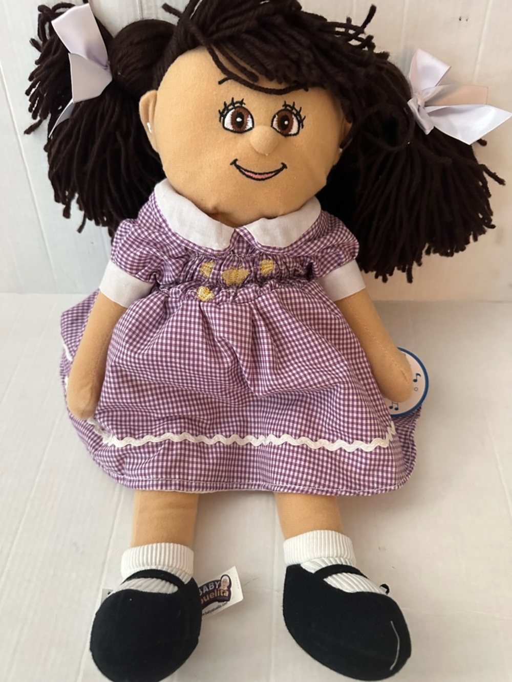 NWT Baby Abuelita Singing Plush Doll Purple Gingham Bilingual Spanish English